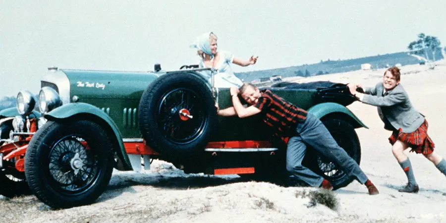 People pushing car