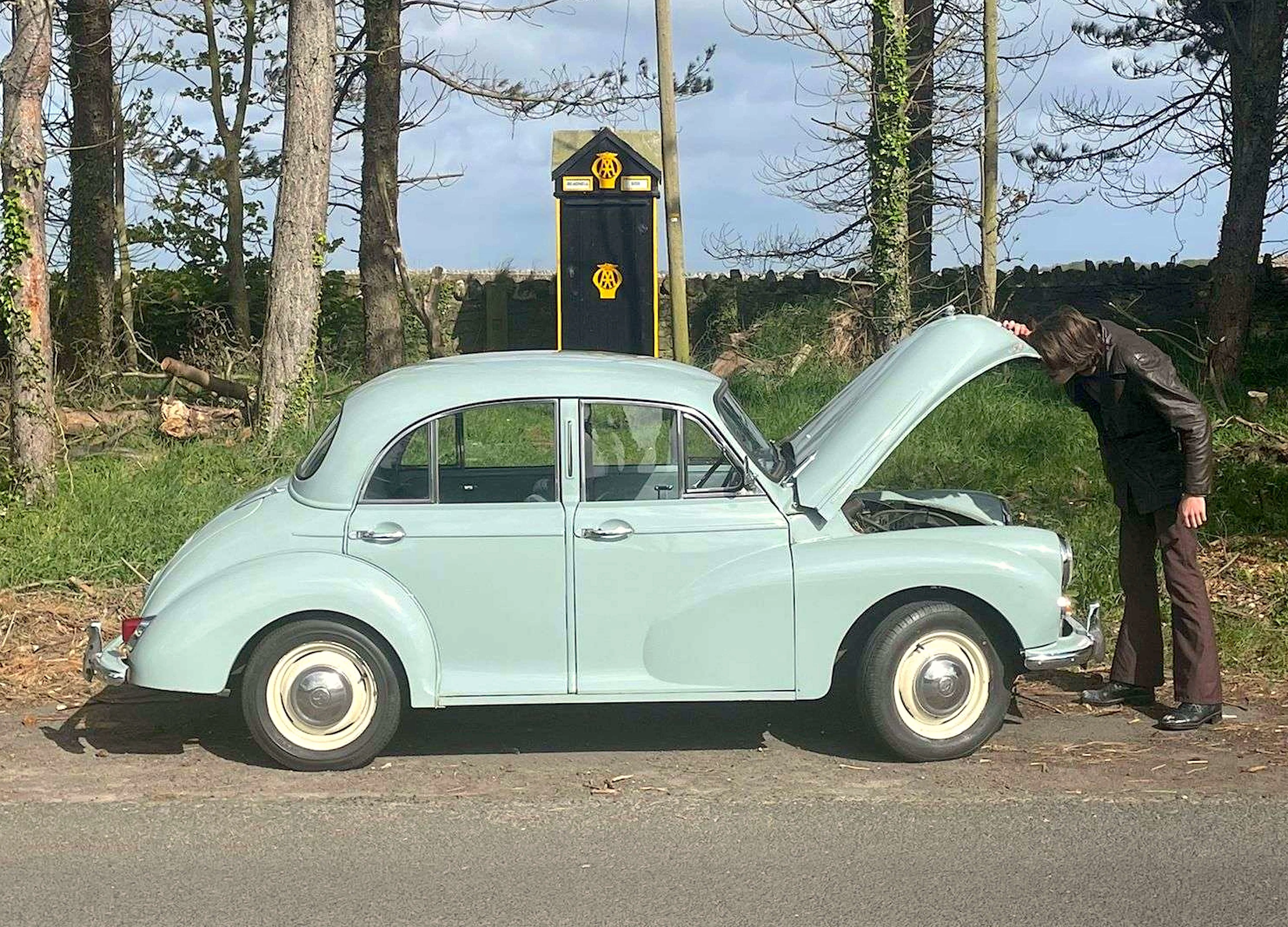 Man looking in car engine