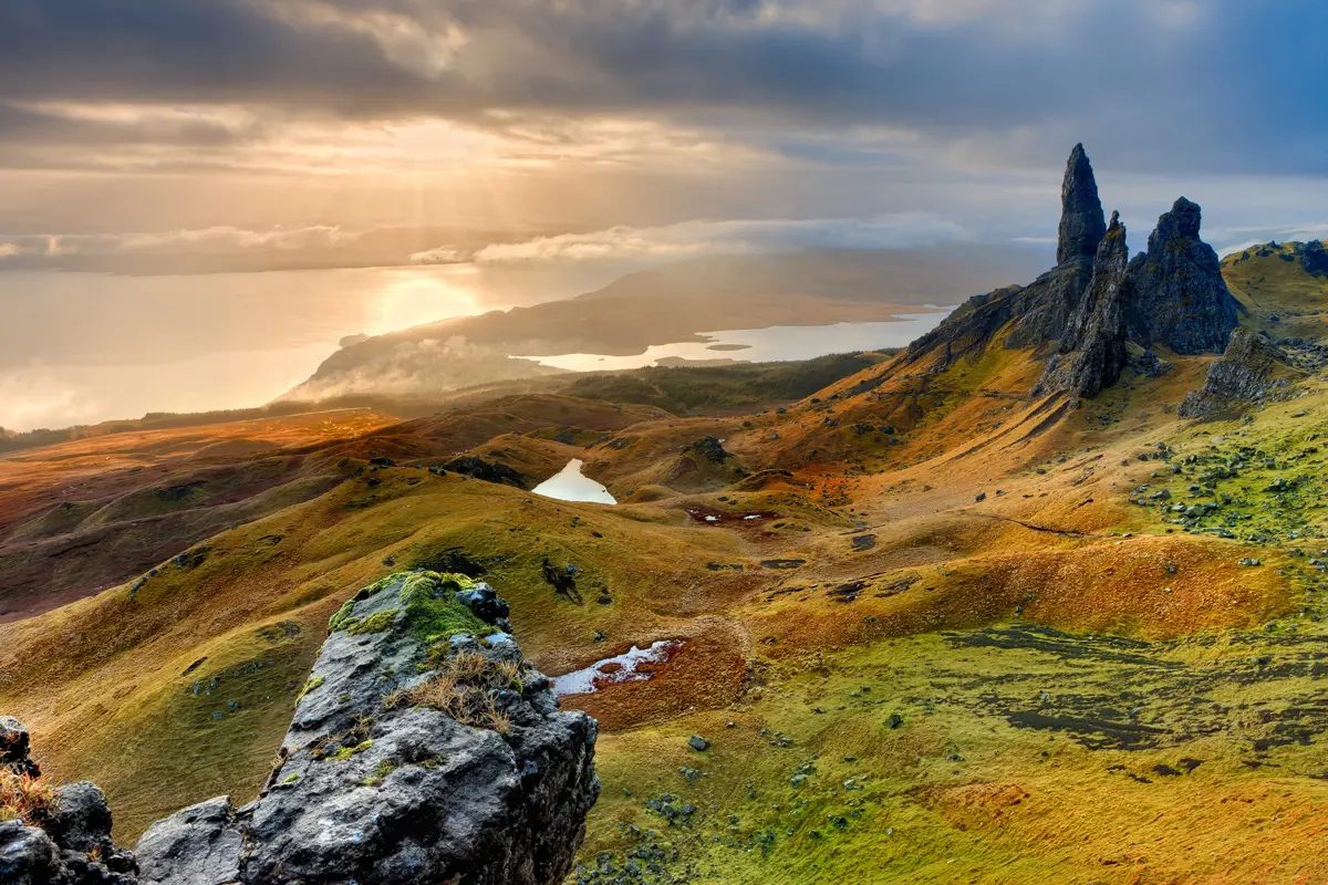 A scenic view of green rolling rocky hills on the Isle of Skye