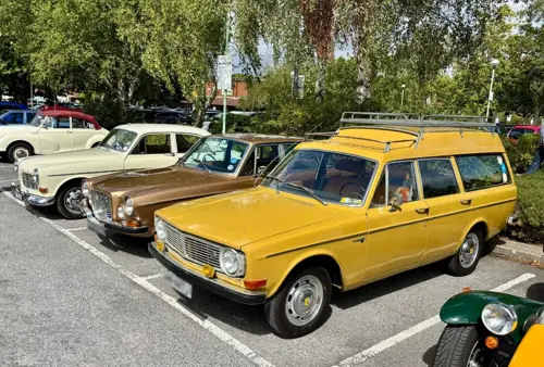 Yellow Volvo 145 Express