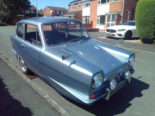 Silver three-wheeled car