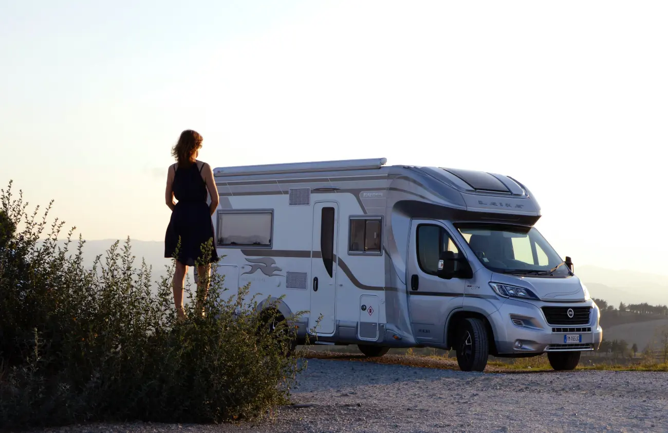 woman stood looking out over her campervan